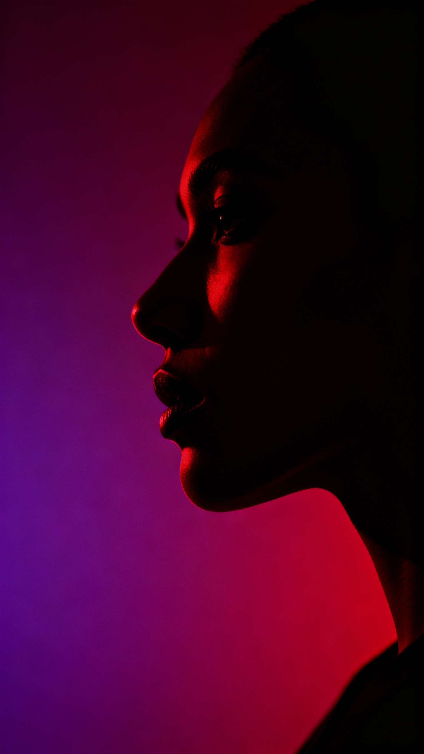 AI generated image using SEEDREAM_4: Impactful fashion photography: neutral profile silhouette, deep red and warm pur...