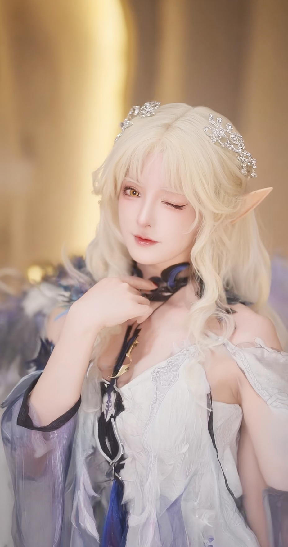 AI generated image using WAN_2_5: A beautiful young woman in a fashionable gown, she has long, golden, curly hair ...