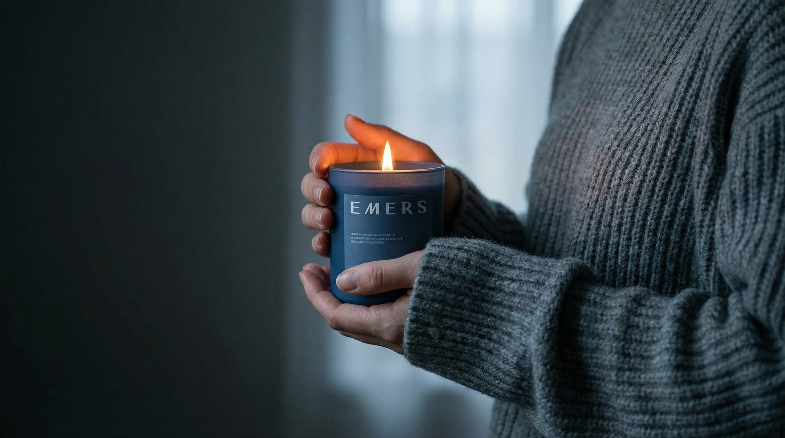 AI generated image using NANO_BANANA_PRO: Quiet dawn. Wearing a grey wool knit. A woman's hand holding the candle from the...