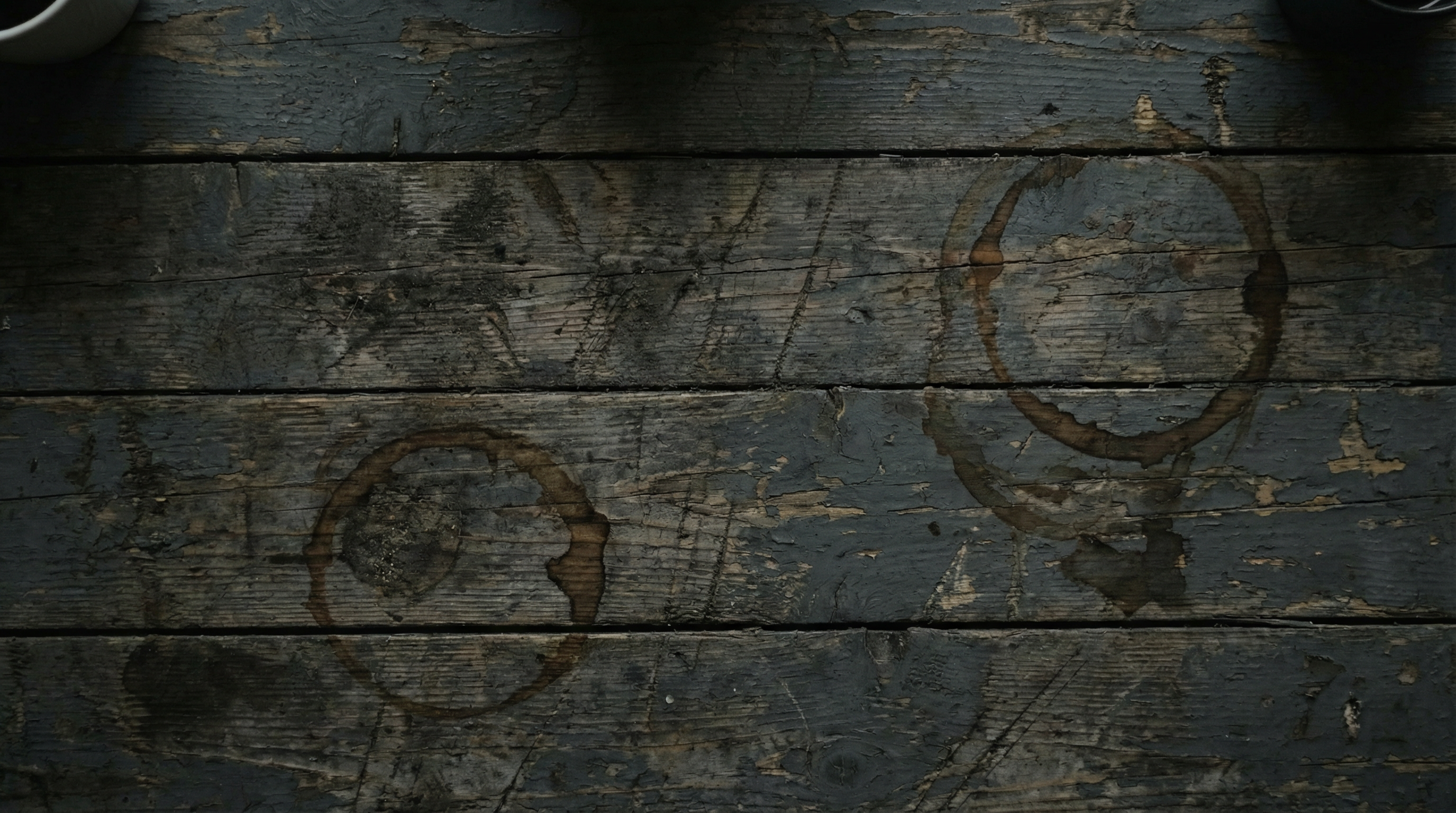 AI generated image using NANO_BANANA_PRO: Top-down 90-degree bird's-eye view of a dark gray grunge-style desk. The surface...